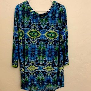 I’m selling a polyester blue blouse with designs on it.